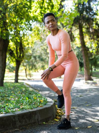 African American woman stretching before a jog