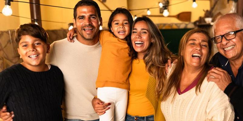 Happy Hispanic Family Enjoying Holidays Together