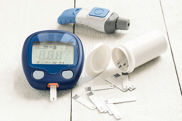 Blood glucose meter with test strips and fingerstick